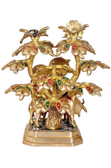 Angled view Radha-Krishna brass idol with cow beneath tree, decorative enamel