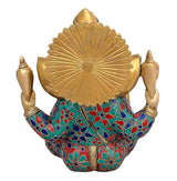 Brass Ganesha idol back view, ornate golden fan halo over jeweled robe