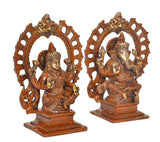 Brass Lakshmi and Ganesha idols, front view, raised hands and ornate circular arches