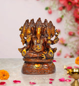 Brass Panchmukhi Ganesha idol, seated four-armed with ornate detailing, 8 inch