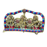 Three deity metal idols with colorful striped arch and jeweled patterns on base