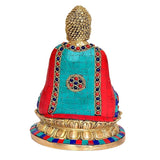 Buddha statue back view, multicolored mosaic robe on lotus base