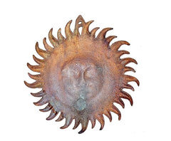 Metal sun statue back with circular spiked rays, weathered copper-brown patina