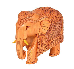 Elephant wooden statue, side view; trunk down and detailed carved head and back.