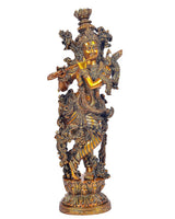 Brass Lord Krishna idol front view with raised flute and intricate jewelry on base