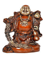 Laughing Buddha brass-tone decoration with orange robe and smiling face, holding coins