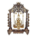 Brass Ganesha swing with ornate frame and hanging bells, brown finish, 26 in