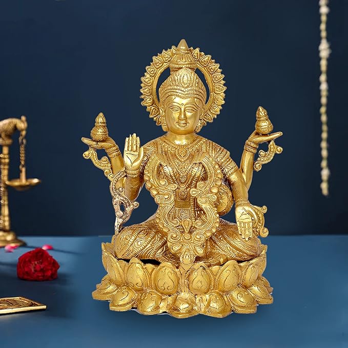 Golden brass Lakshmi deity statue seated with four arms and ornate crown