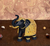 Resin royal elephant figurine with gold carved details and dark trunk, decorative showpiece