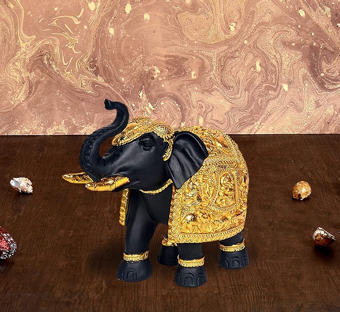Resin royal elephant figurine with gold carved details and dark trunk, decorative showpiece