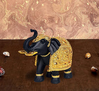 Resin royal elephant figurine with gold carved details and dark trunk, decorative showpiece
