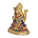 Maa Lakshmi brass idol from side, multicolor patterned sari, raised hands