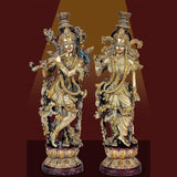 Brass Radha Krishna idol statue, two figures with ornate crowns and raised arms