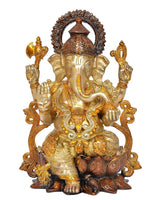 Ganesha brass idol seated on lotus base, raised hands, detailed arch halo