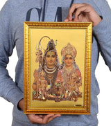 Framed Shiv Parivar foil poster held upright, golden ornamental border and deity figures
