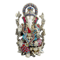 Brass Ganesha statue with carved dhoti, jeweled halo and four arms, 12.9 in