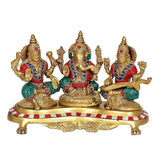 Brass Lakshmi Ganesh Saraswati statue, three-figure seated group on patterned base