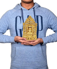Brass Mahavir Swami statue figurine held in hands, compact 9 inch size