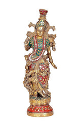 Brass Radha-Krishna decorative idol, single figure holding flute, jeweled teal-red attire