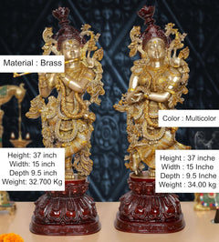 Brass Radha Krishna idol, front view with gold ornaments and maroon decorative base