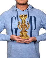 Gold brass Durga Mariamman idol held in hands, four-armed seated figure