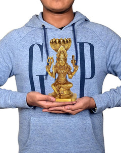 Gold brass Durga Mariamman idol held in hands, four-armed seated figure