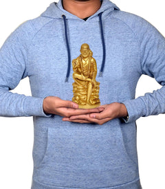 Brass Shirdi Sai Baba statue (6 inch) held in hands for size comparison
