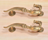 Brass yali design door handle pair, matching curved levers with ornate elephant motifs