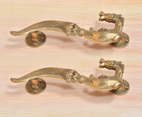 Brass yali design door handle pair, matching curved levers with ornate elephant motifs