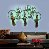 Iron wall art musicians with LED halo frames, green-lit circles and gold figures