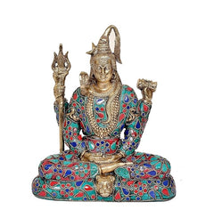 Brass Shiva statue meditating, teal-blue and red beadwork style robe on base