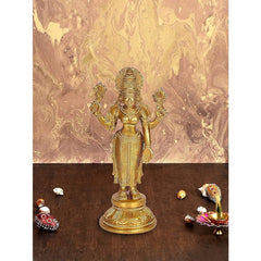 Standing brass Lakshmi idol with four arms, golden finish, round base