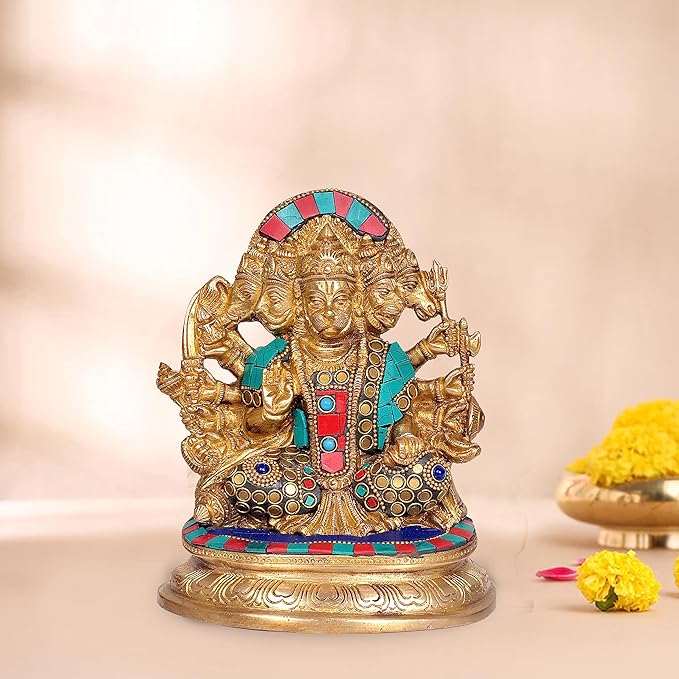 Brass Panchmukhi Hanuman idol: seated figure with colorful crown, teal/red attire