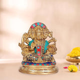 Brass Panchmukhi Hanuman idol: seated figure with colorful crown, teal/red attire