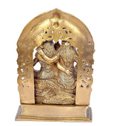 Brass Shiv Parivar idol back view: sculpted arch with textured figures