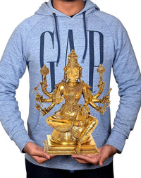 Gold eight-armed Varahi idol figurine held in hands, detailed seated design