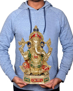 Brass Ganesha statue held in hands on height display, multicolor jewel details on pedestal