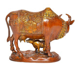 Brass cow with calf statue, side view with detailed ornaments and relief work