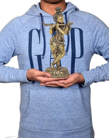 Brass Lord Krishna flute idol figurine on pedestal, held in hands for display