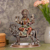 Bonded bronze Durga statue seated on lion, multi-armed with ornate headdress