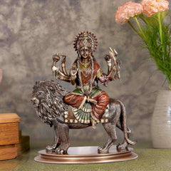 Bonded bronze Durga statue seated on lion, multi-armed with ornate headdress