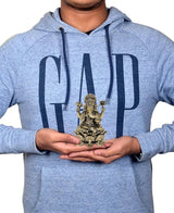 Brass Ganesha idol in hands, small 4-inch religious statue