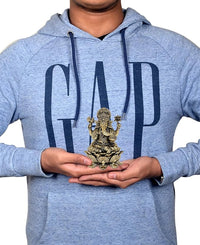 Brass Ganesha idol in hands, small 4-inch religious statue