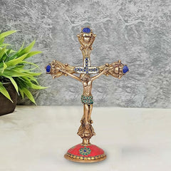 Brass Jesus cross sculpture with blue jeweled details and ornate figure, 11.5 in