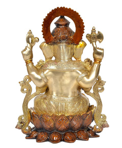 Brass Ganesha idol back-to-front view, seated on lotus, raised hands and halo