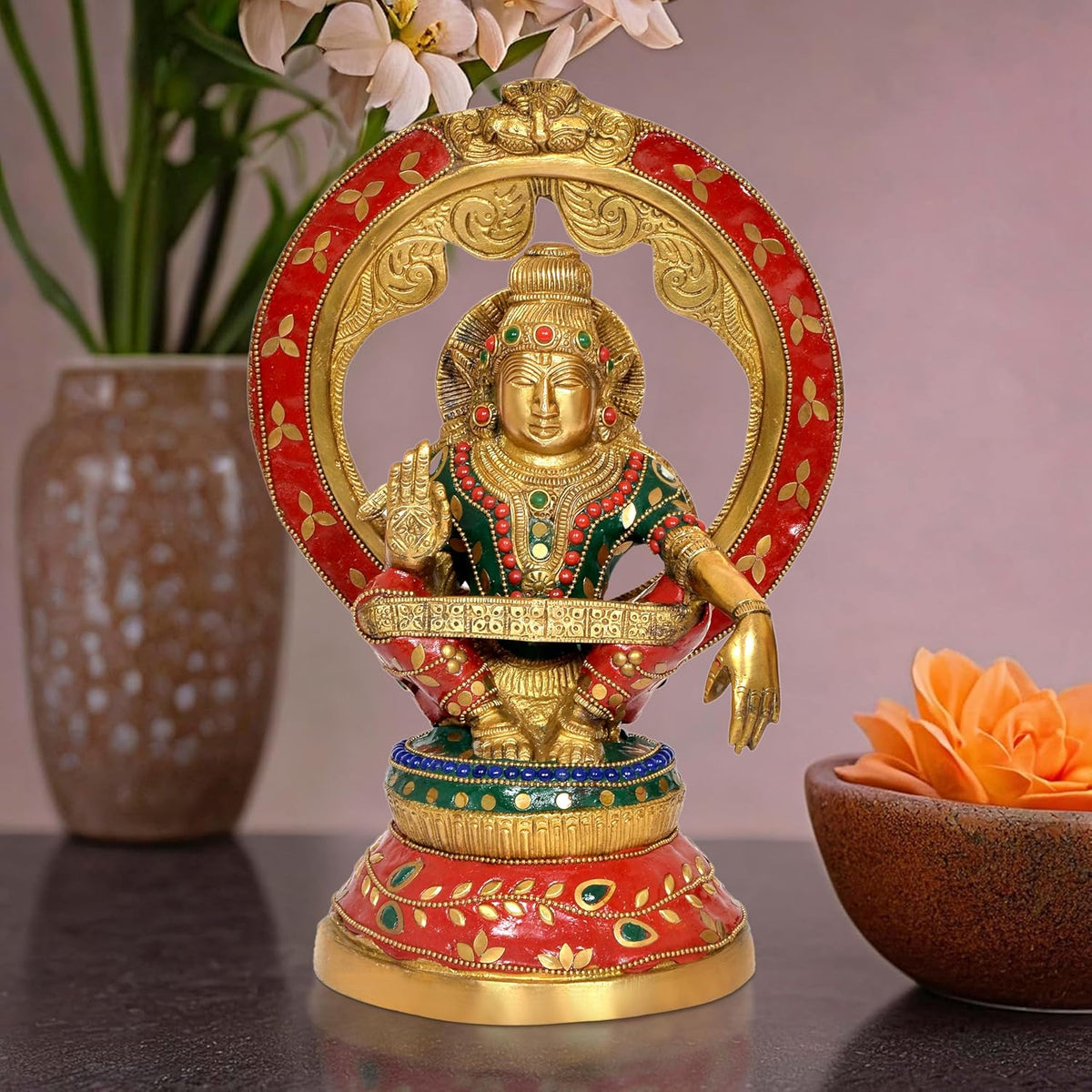 Seated brass Ayyappa idol with red-gold halo and colorful jeweled outfit