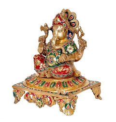 Brass Lord Ganesha idol statue side view, jeweled garments and decorated base