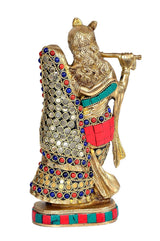 Brass Radha Krishna idol, stone inlay; side view, Krishna flute raised, Radha close.