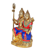 Brass Shiv-Parvati idol on base, teal jewelry details, raised hands, trident