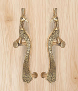 Brass peacock door handles pair with round knobs and detailed wing and tail pattern